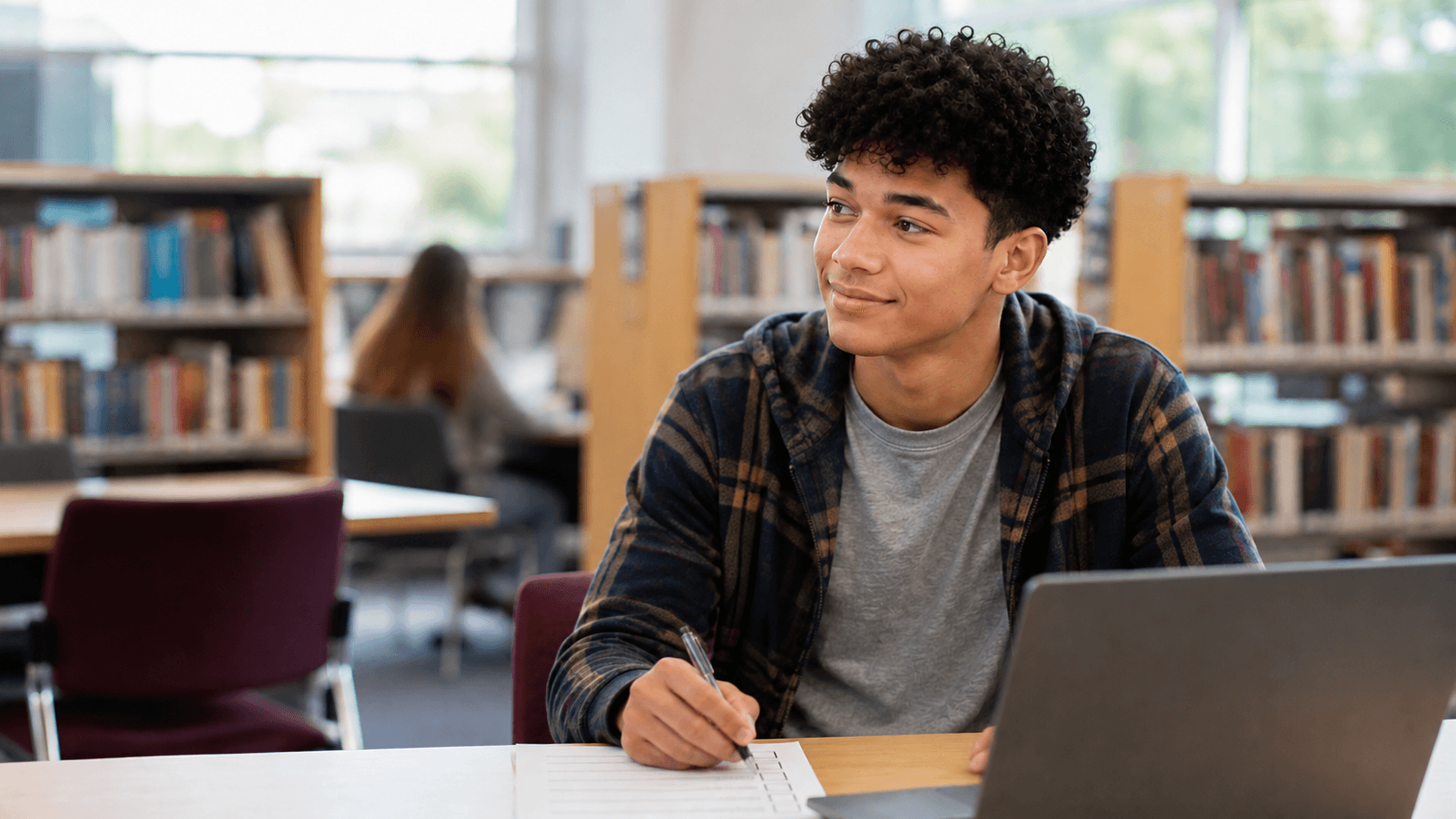 College student beginning a digital induction in a library